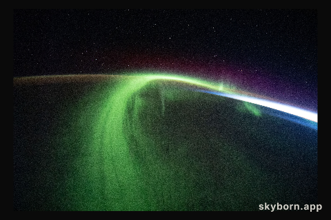 A vivid aurora streams over the Earth as the International Space Station orbited 273 miles above the southern Indian