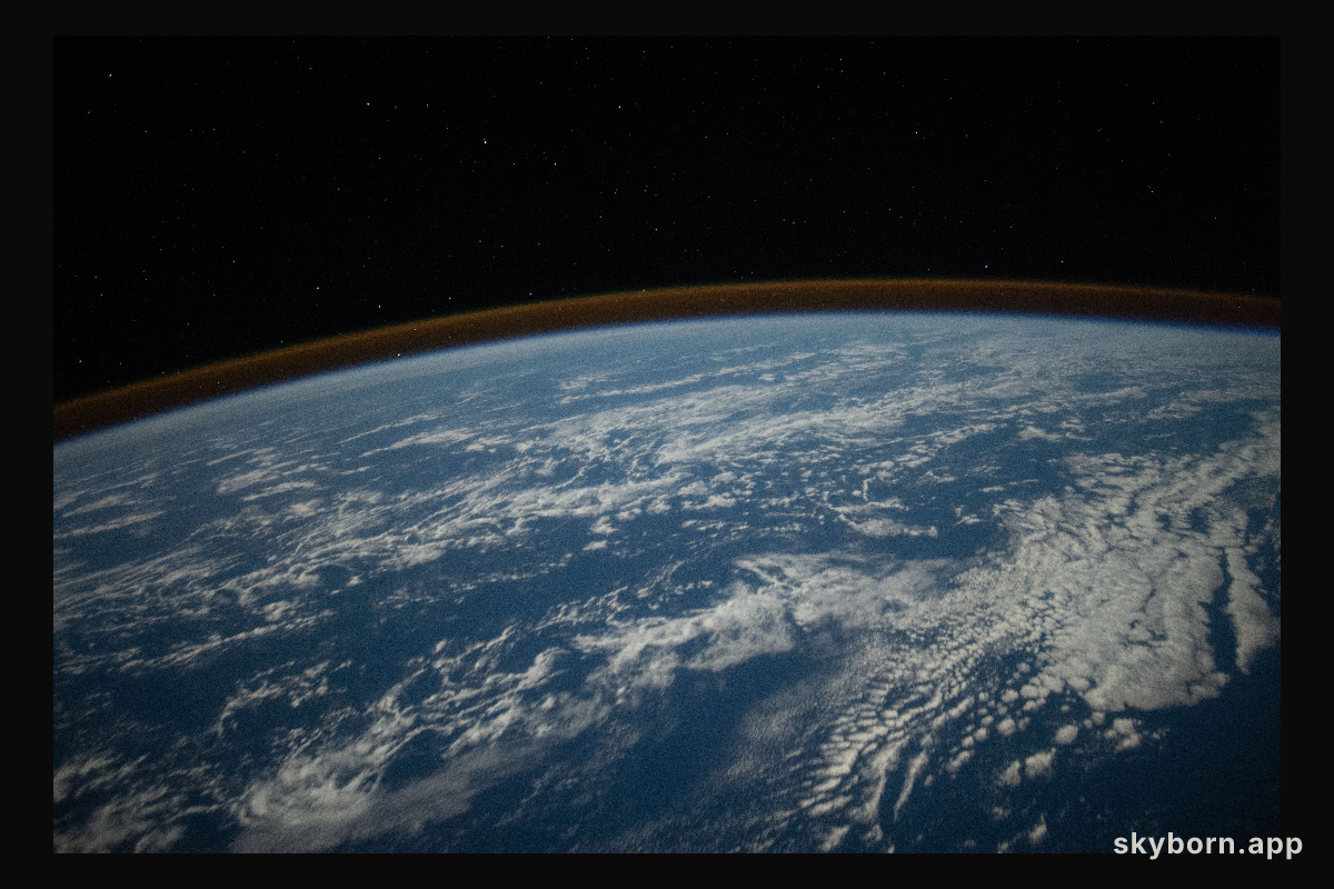 The airglow blankets the Earth's horizon in this photograph from the International Space Station as it orbited 262