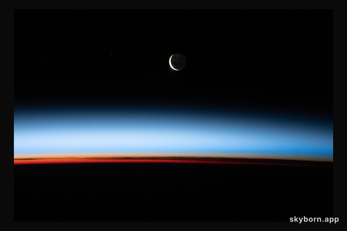 A waxing crescent Moon during is pictured from the International Space Station during an orbital sunset as it flew 268