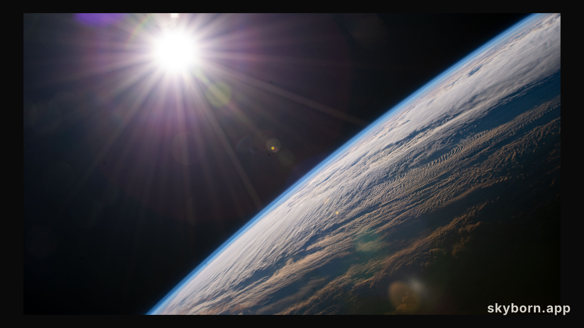 The sun shines above the Earth's horizon as the International Space Station orbited 264 miles above the Canadian