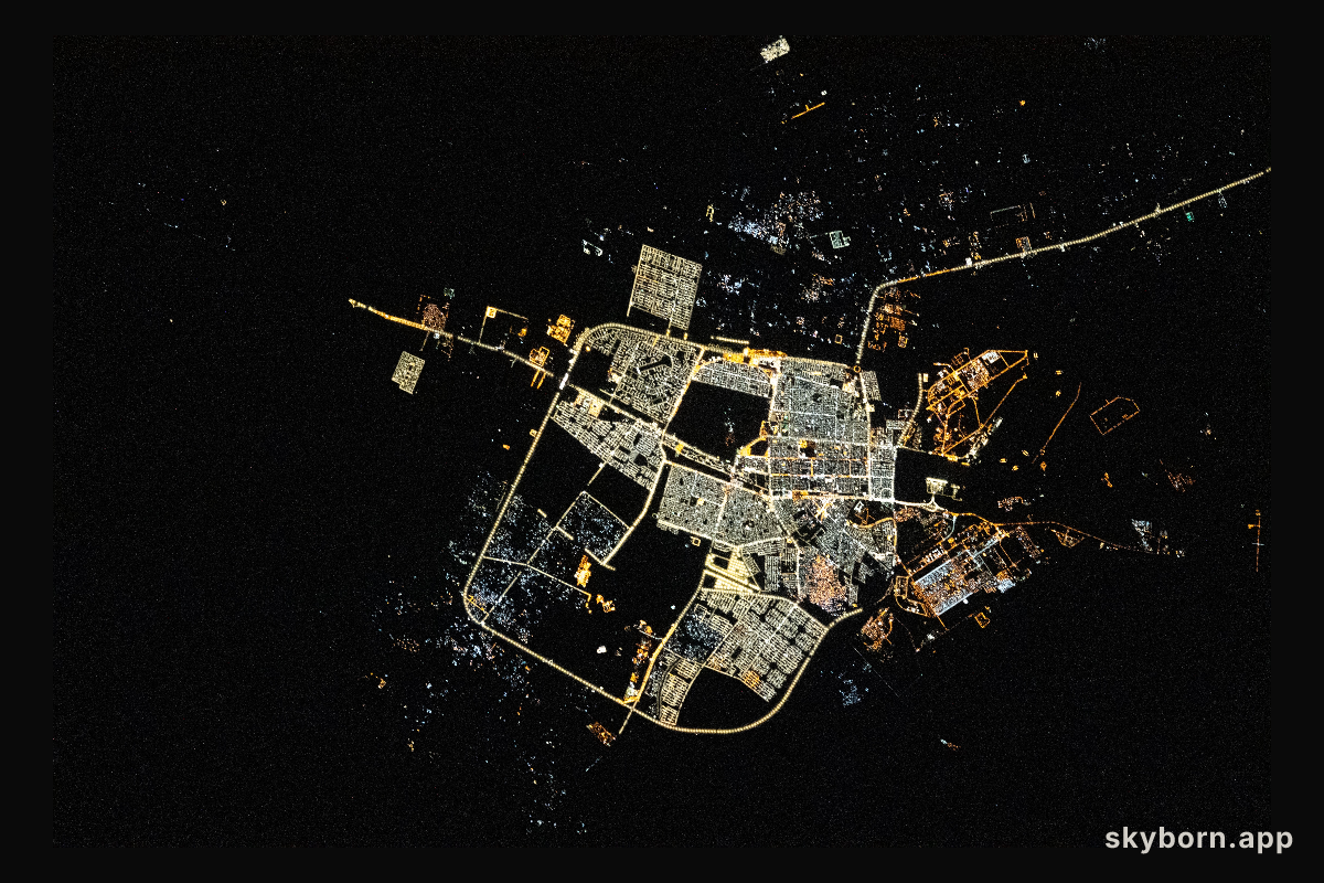 The city lights of Tabuk, a Saudi Arabian city near the border with Jordan, are pictured during an orbital nightime