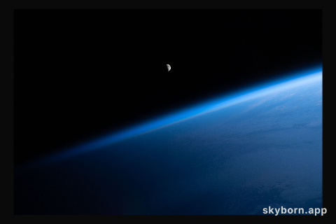The waning crescent Moon is pictured from the International Space Station as it flew into an orbital sunrise 260 miles
