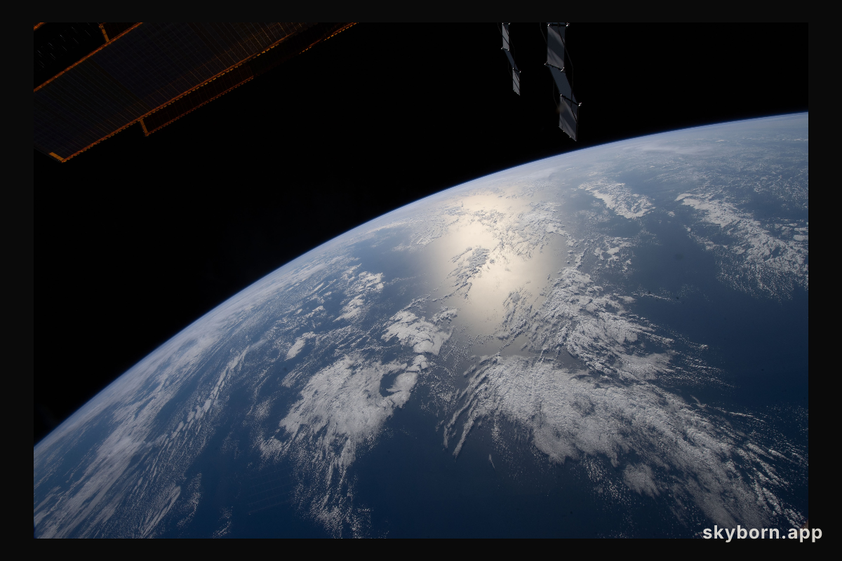 The sun's glint beams off the Atlantic Ocean off the coast of Angola as the International Space Station orbited 264