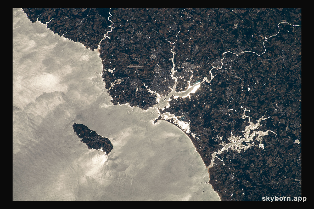 The island of Groix is pictured off the northwestern coast of France with the Atlantic Ocean beaming from the sun's