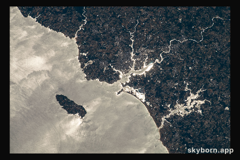 The island of Groix is pictured off the northwestern coast of France with the Atlantic Ocean beaming from the sun's