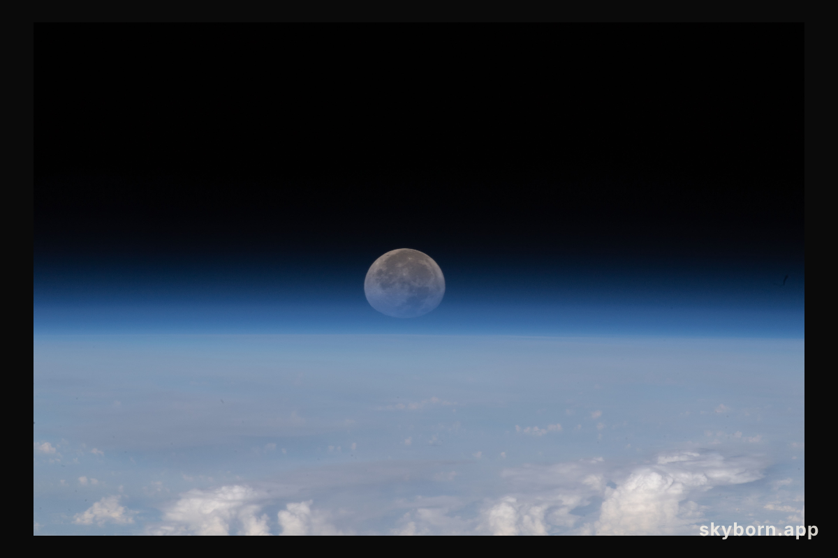 As the Moon sets below Earth's horizon the atmosphere refracts, or bends, its light making it appear flatter in this