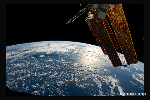 The sun's glint beams off the Coral Sea northeast of Australia as the International Space Station orbited 264 miles