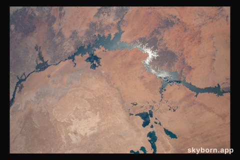 The sun's glint beams off Lake Nasser in Southern Egypt in this photograph from the International Space Station as it