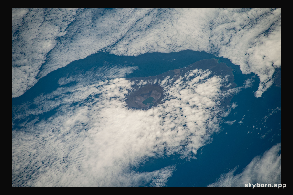 The peak of La Cumbre Volcano on Ecuador's Fernandina Island, part of the Galapagos Islands, is surrounded by clouds