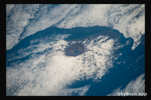 The peak of La Cumbre Volcano on Ecuador's Fernandina Island, part of the Galapagos Islands, is surrounded by clouds