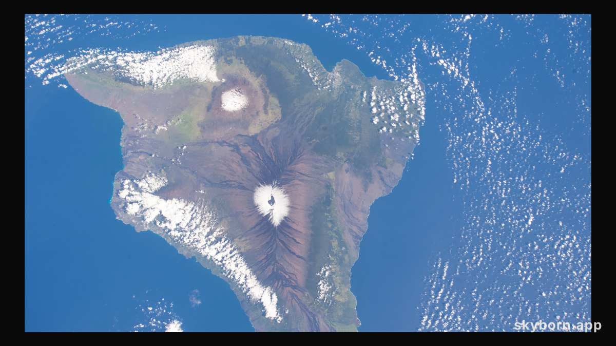 The snow-capped peaks of two different volcanoes on the island of Hawaii, Mauna Loa, an active volcano (bottom),