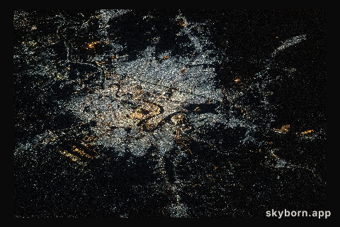 The city lights of Baghdad, Iraq, split by the Tigris River, are pictured from the International Space Station as it