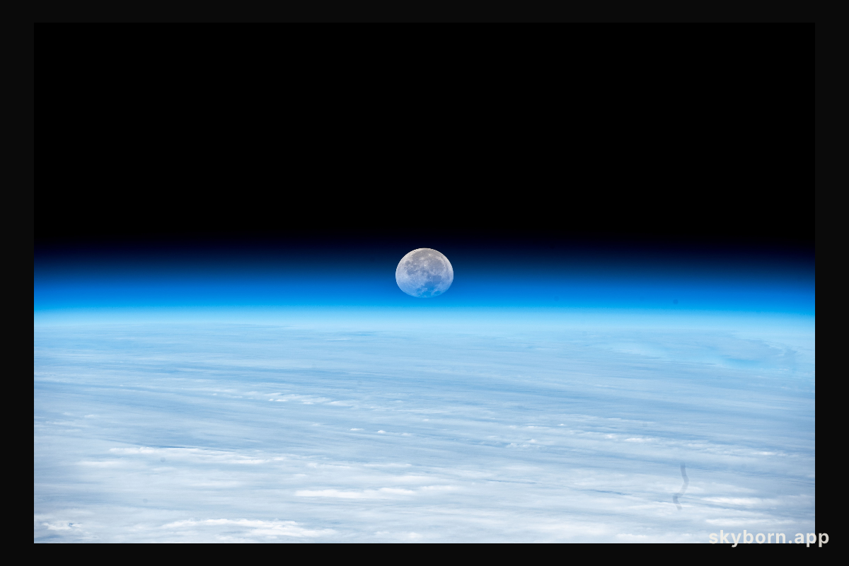 The Moon's image is refracted due to Earth's atmosphere in this photograph from the International Space Station as it