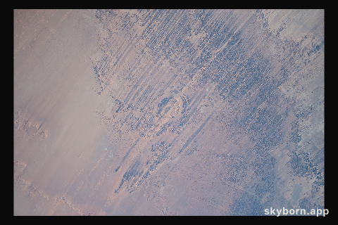 The eroded Aorounga meteorite impact crater, also known as the "Eye of the Desert," in the African nation of Chad is