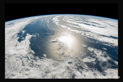 The sun's glint beams in between a cloudy stretch of the south Atlantic Ocean off the coast of Argentina