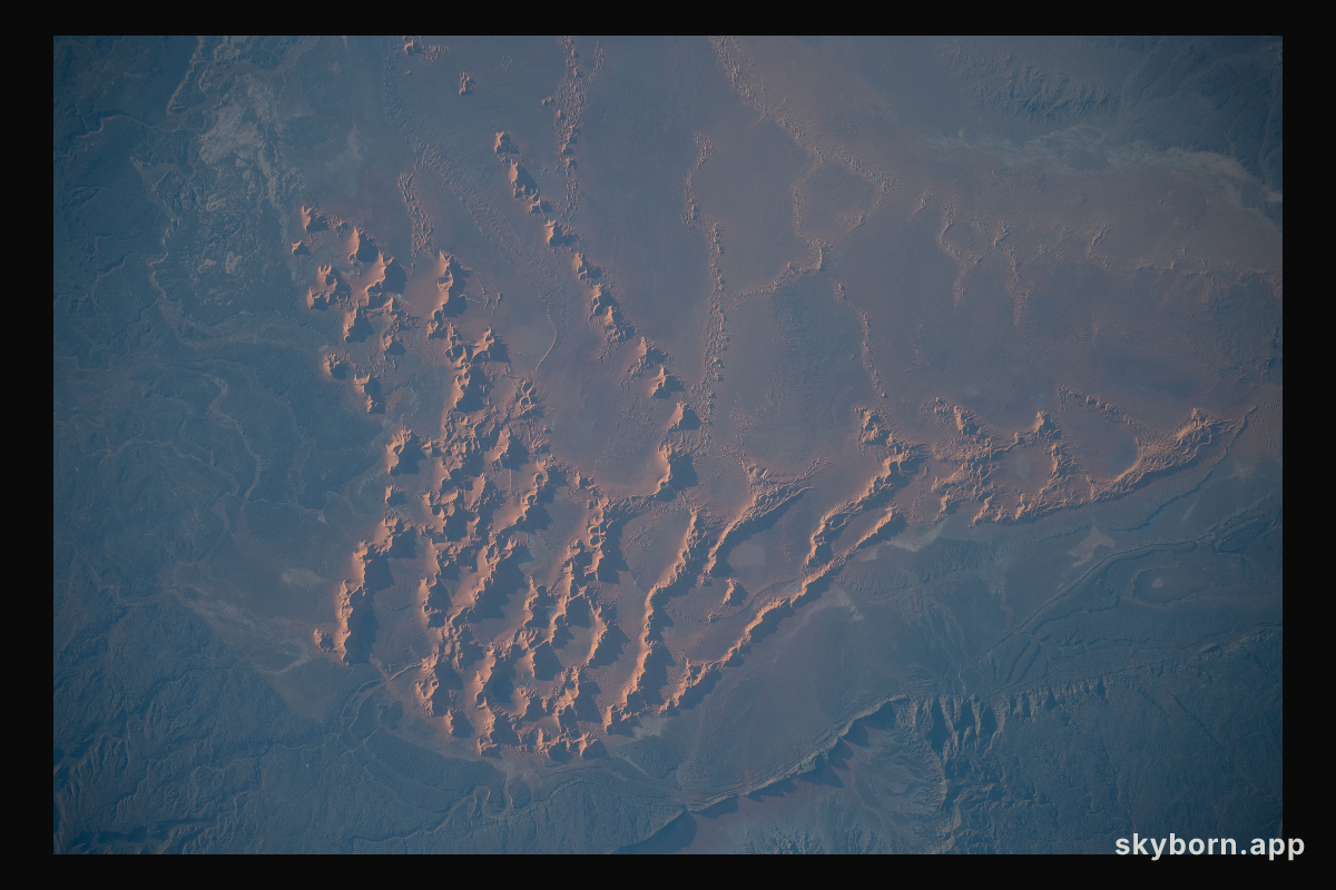 Sand dunes and massifs in the Algerian Desert are pictured from the International Space Station as it orbited 260 miles