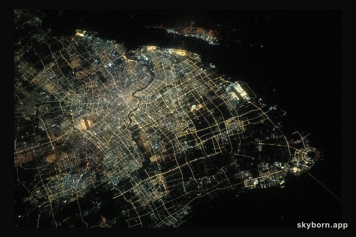 The city lights of Shanghai, the most populous city in China with a population of about 24.9 million, and the Huangpu
