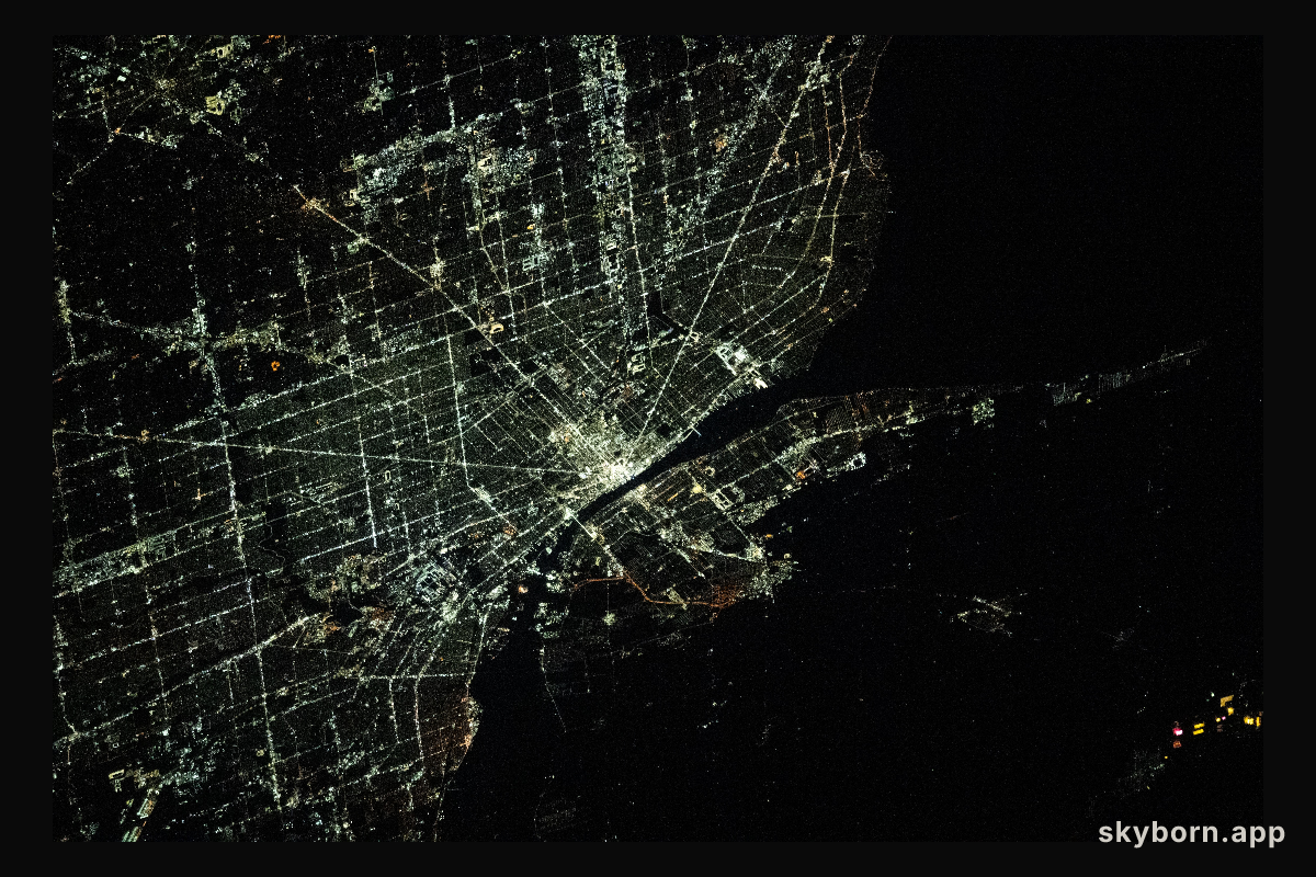 The city lights of Detroit, Michigan, separated from the city of Windsor in Ontario, Canada, by the Detroit River, are