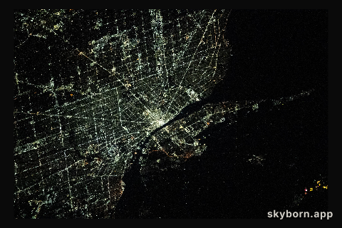 The city lights of Detroit, Michigan, separated from the city of Windsor in Ontario, Canada, by the Detroit River, are
