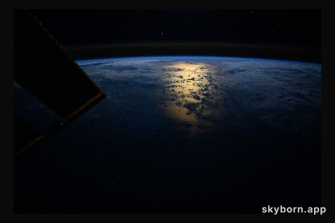 The Sun's glint beaming off the South Pacific Ocean near the coast of Chile just after an orbital sunrise and a slight