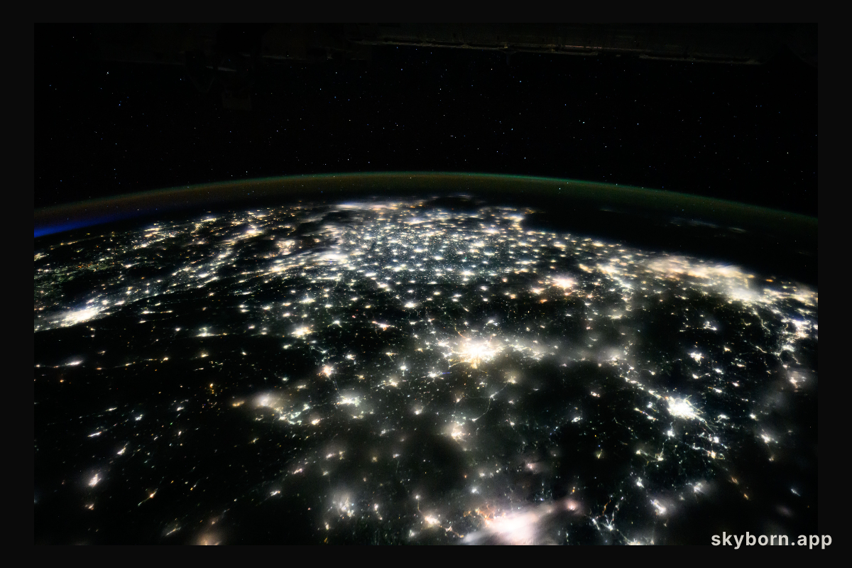 City lights illuminate the country of China to the East China Sea in this nighttime photograph from the International