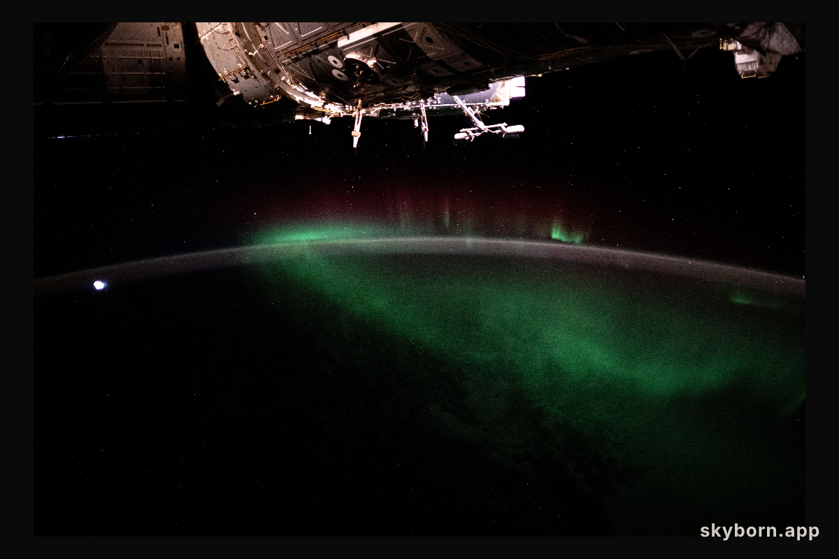 The aurora australis, also known as the Southern Lights, shimmers over the Indian Ocean in between Australia