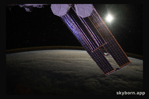 The Moon illuminates a cloud-covered Pacific Ocean