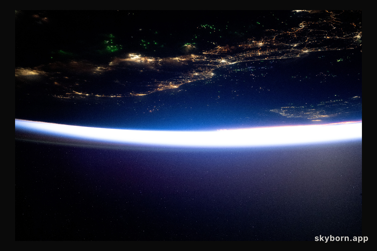 The city lights of southern Thailand and Malaysia sit in between the Malacca Strait (top) and the Gulf of Thailand