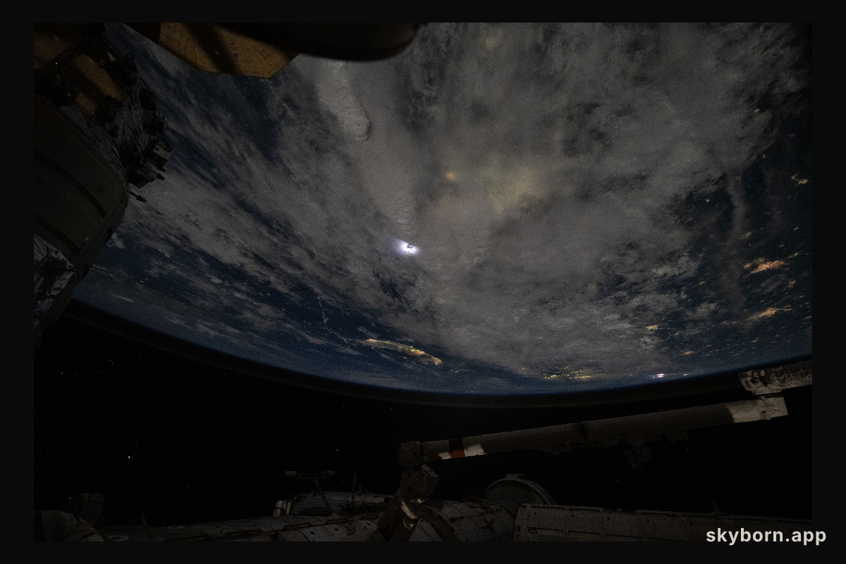 Lightning (at center) illuminates the storm clouds above China near the coast of the Taiwan Strait in this photograph