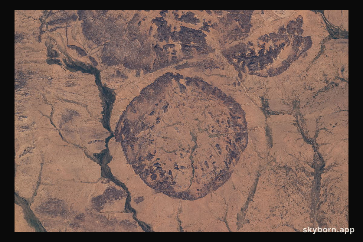 Ancient settlements surround this circular, geological feature in Mali