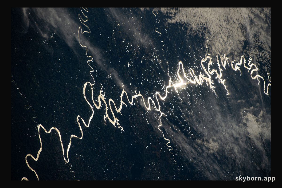 The Sun's glint beams off a river in South America