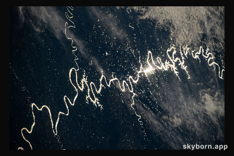The Sun's glint beams off a river in South America