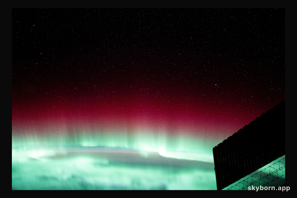 A red and green aurora borealis above Canada's Gulf of St. Lawrence