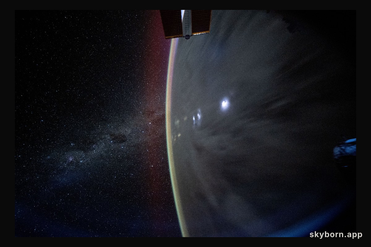 The Milky Way appears beyond Earth's horizon