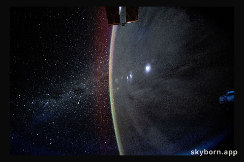 The Milky Way appears beyond Earth's horizon