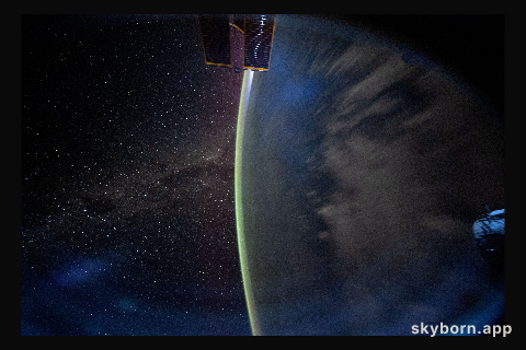 The Milky Way appears beyond Earth's horizon