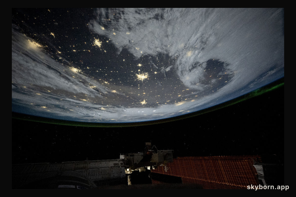 City lights dot the cloudy, midwestern landscape of the United States