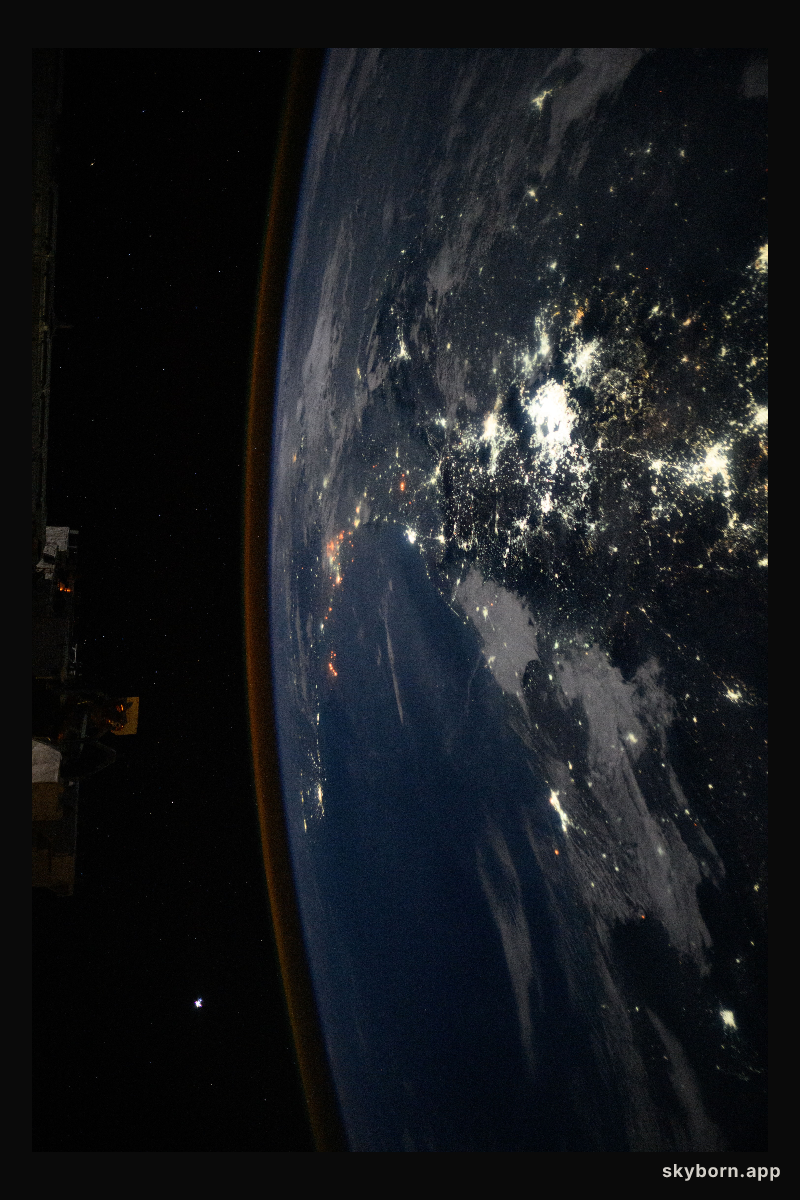 The city lights of Mexico City and its surrounding suburbs dominate the nightscape