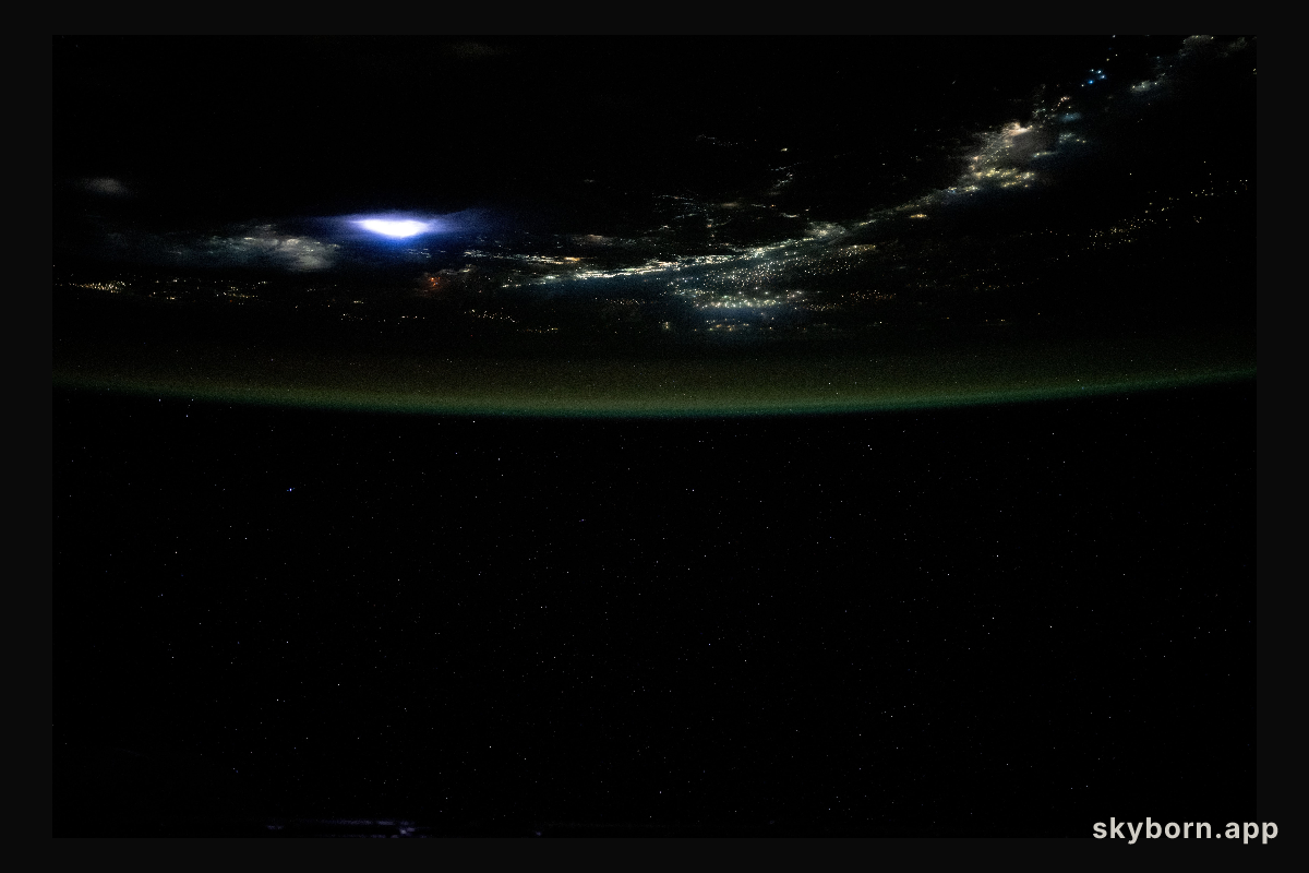 Lightning illuminates the clouds above Southeast Asia