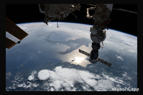 The sun's glint beams off the Adriatic Sea contrasting with the "boot" of Italy