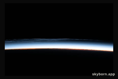 Noctilucent clouds are pictured above the North Pacific Ocean