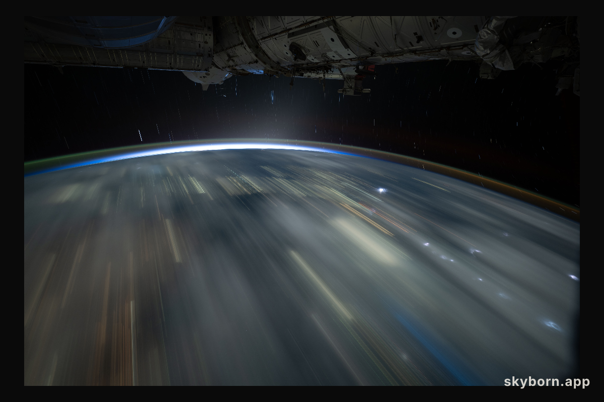 The city lights of Southeast Asia and lightning storms streak below the International Space Station