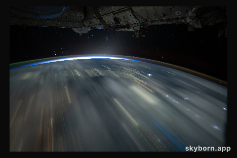 The city lights of Southeast Asia and lightning storms streak below the International Space Station