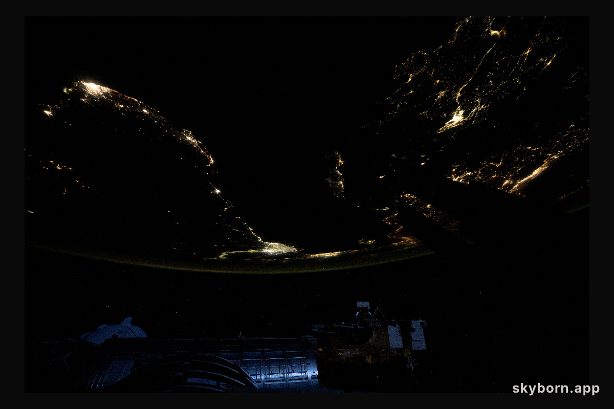 City lights outline the Mediterranean Sea coast