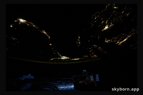 City lights outline the Mediterranean Sea coast