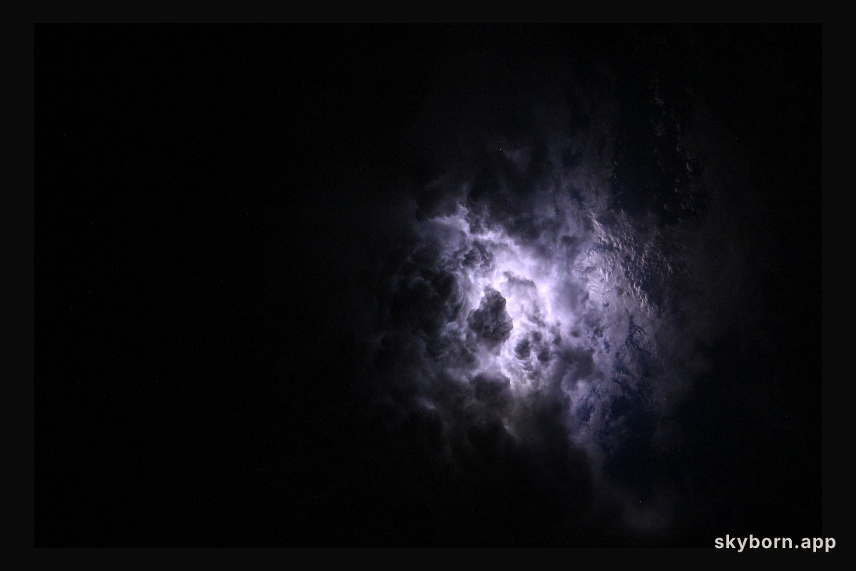 Lightning illuminates the cloud tops of Category 1 Hurricane Erick