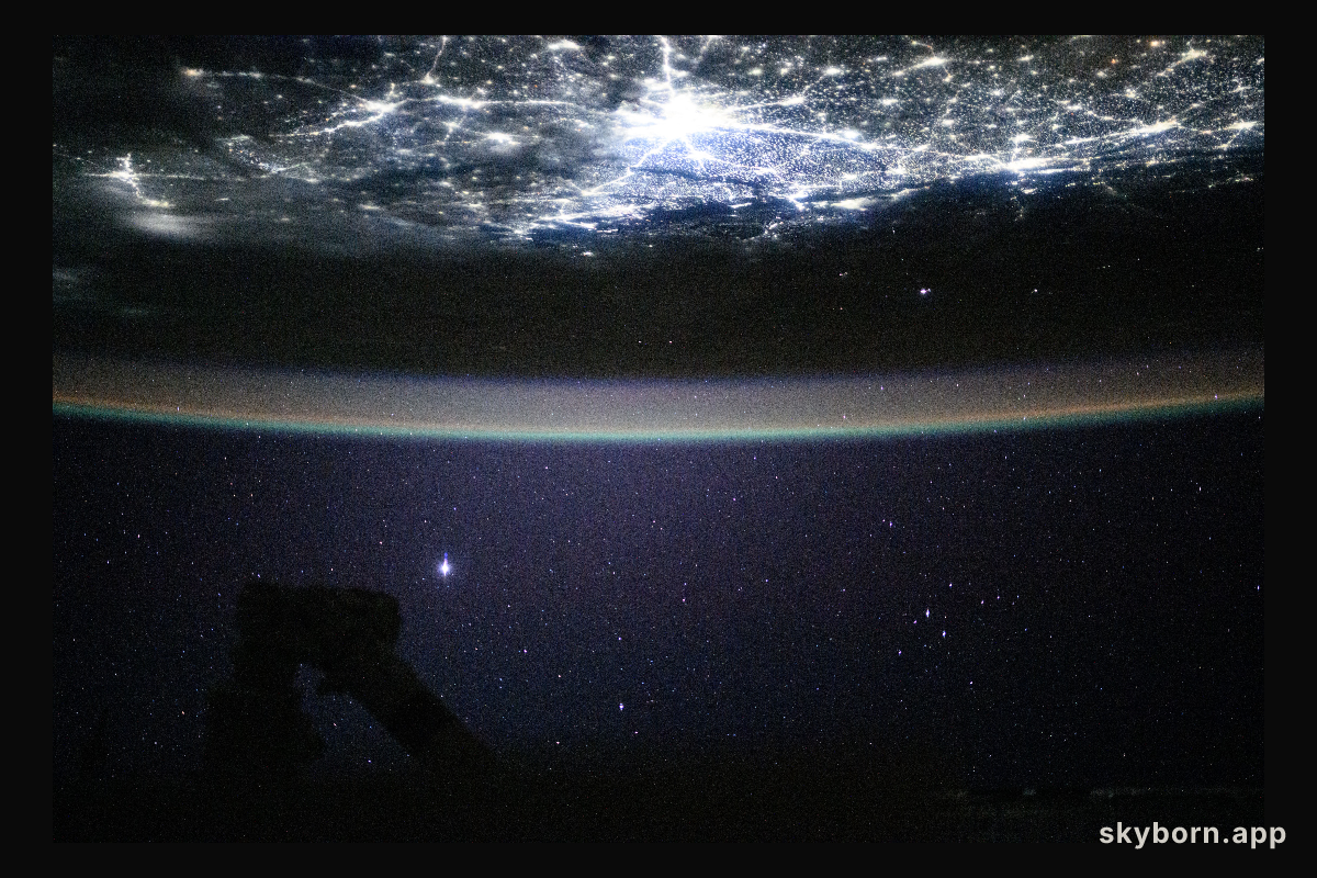 The city lights of New Delhi, India, underneath a starry night sky