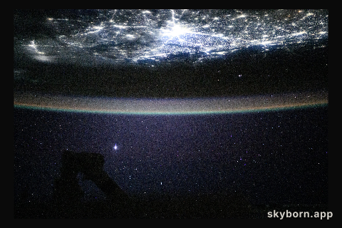 The city lights of New Delhi, India, underneath a starry night sky