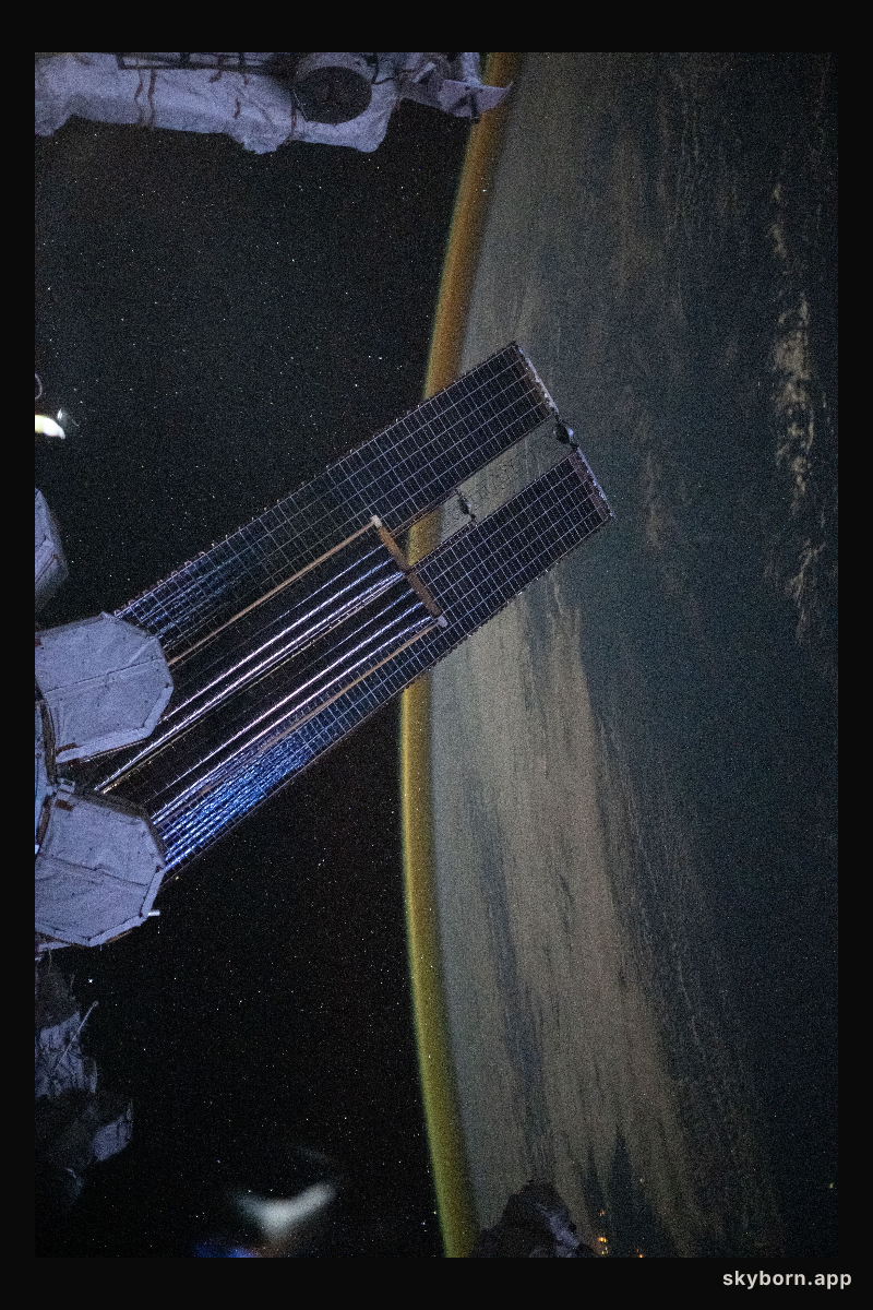 A dim, yellow-green airglow crowns Earth’s horizon between northwestern Australia and Indonesia