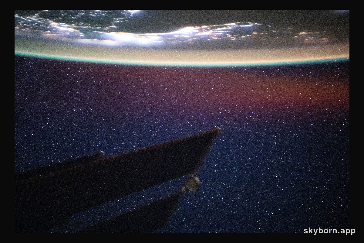 The Persian Gulf region is illuminated beneath a bright yellow-green airglow